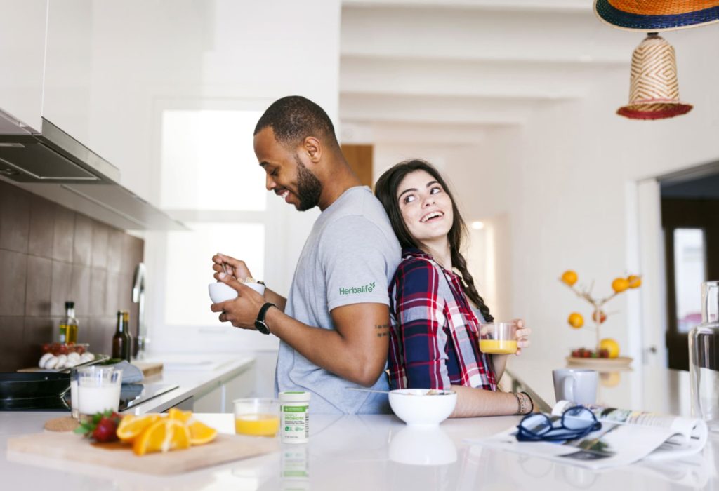 Couple in their kitchen enjoying a healthy breakfast
